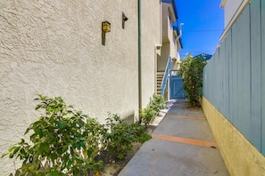 Walkway from front gate to the stairs that lead to the front door