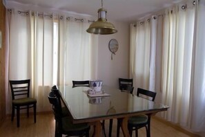 This Glass Covered Dining Room Table seats 8 for Dinner or a Card game or just some old fashioned Conversation.
