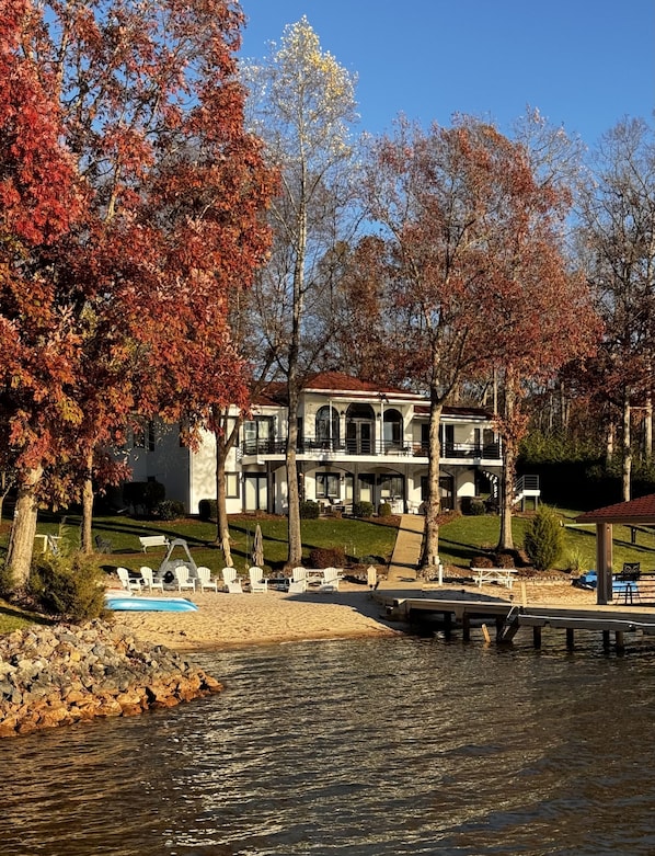 Two stories of lake views and Private Beach with a huge Great room and Kitchen.