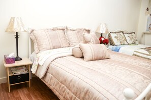 Room 1. 2 Full Sized Beds can sleep 4. Night stand and magazines for your use.