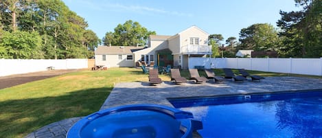 Hot tub with spill over spa. This shows just how big the back yard property is