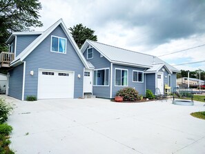 Renovated cottage with standing seam metal roof, new siding, patio and more!