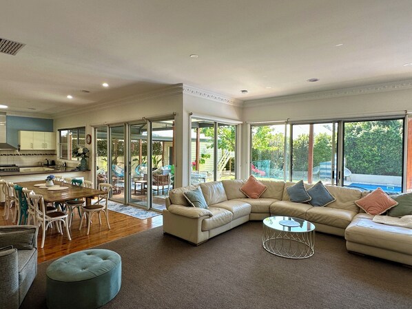 Glorious open plan sunny living with a view to the pool