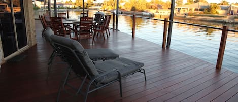 The spacious deck complete with 9 seat outdoor setting and BBQ and 2 lounges