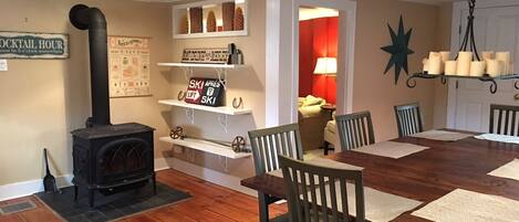 Kitchen / dining area with a wood burning stove