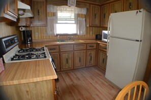 New Kitchen Floor, Gas Stove , Microwave and Full size Fridge