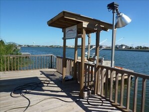 Private deck and boat dock with view to the harbor