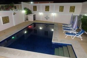 Majestic Villas 1, 2 bedroom. Pool area at night time.