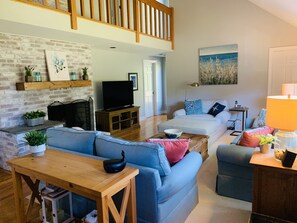 Wood burning fireplace and 55" flat screen tv
