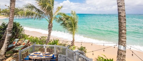 Shot from the upstairs living room lanai, showing our great beachside space.