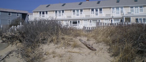 Unit top floor end unit.  on left This photo was taken standing on beach 