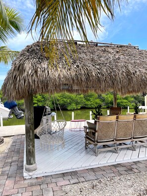 Large tiki overlooking canal