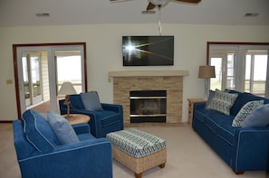 Living room with two sliding doors to the porch