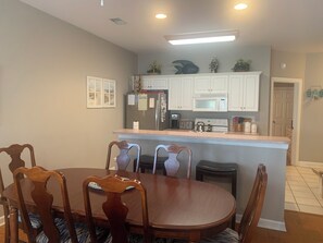 Villa Dining and Kitchen. New stainless refrigerator with bottom freezer