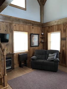 Log cabin with country ambiance located within city conveniences