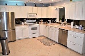 Kitchen is fully equipped with dishware, cookware and every appliance imaginable