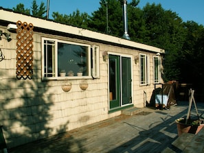 Deck for taking in the sun and night stars, a screen room is currently set up.