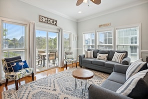 Living room with access to the screened in patio.