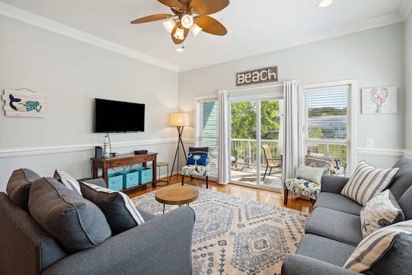 Living room with access to the screened in patio.