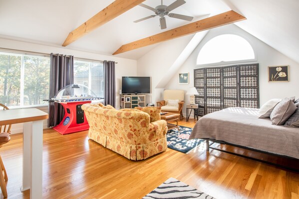Light filled and roomy open floor plan with cathedral ceiling.  Large screen tv.