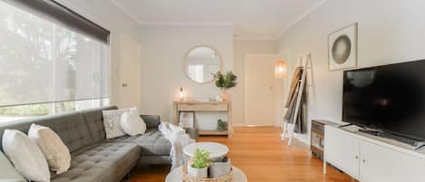 Lounge area with smart TV, air conditioning and heating