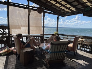 The covered deck offers a shady to spot to read and relax.