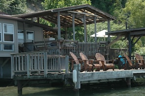 The water is just chest deep off the dock and ankle deep closer to the house.