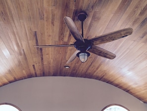 Domed red oak ceiling.  Ceiling fan.  Open concept living 25' by 25' room.