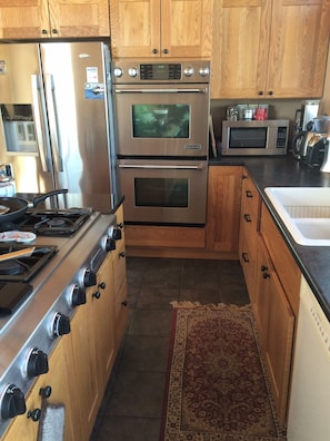 Kitchen, jennair stove and ovens, stainless steel fridge. Dishwasher.
