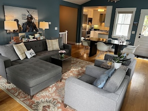 The living room features plenty of space to relax or entertain a few friends.