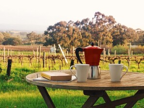 Enjoy your morning coffee with a view of the vines and hills