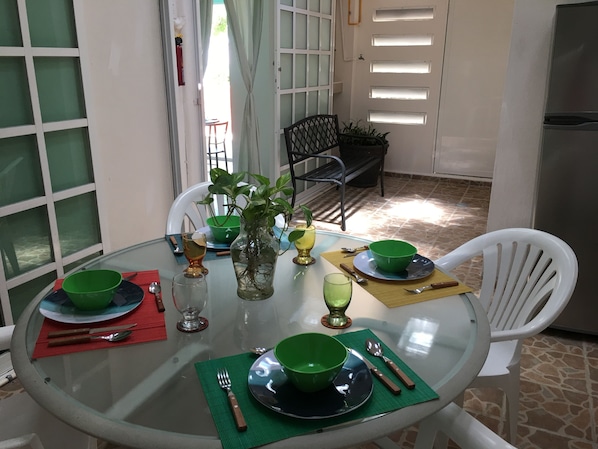 The apartment has a dinning area, kitchenette, two bedrooms and two bathrooms.