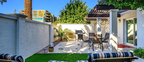 Lounging Area and Patio Area with Outdoor dining area and Gas Grill.