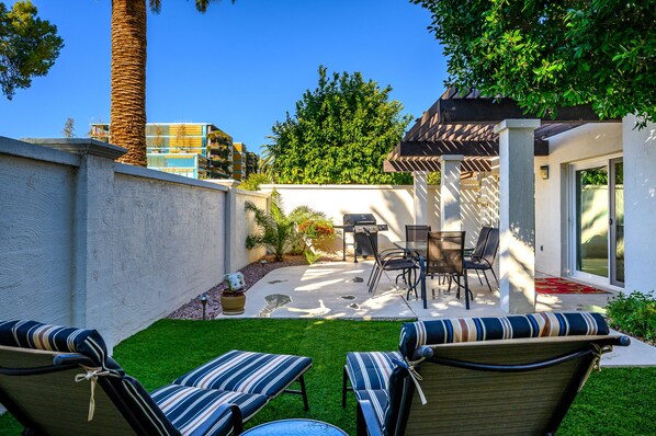 Lounging Area and Patio Area with Outdoor dining area and Gas Grill.