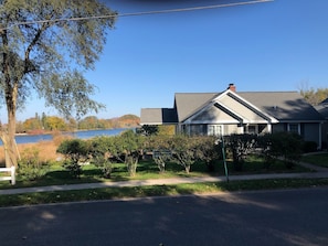 Southern elevation facing the street with South Bar Lake in the background.