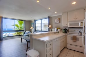 Open style floor plan with California-style kitchen and oceanview