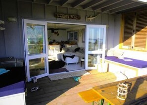  living area out onto large deck, sea views