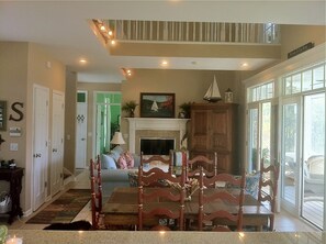 family room/ dining room from kitchen. three double french doors open to porch 