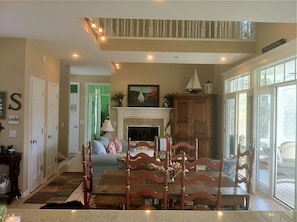 family room/ dining room from kitchen. three double french doors open to porch 