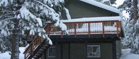 Snowy deck from the backyard