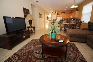 huge flat screen TV and direct access to the pool lanai