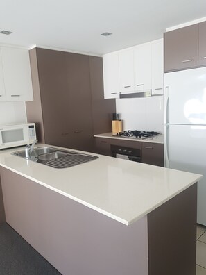 This is a fully stocked kitchen, with cookware and basics for a meal.