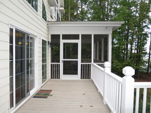 Back Porch and screened porch with lake view. A great place to relax!