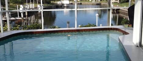 Heated pool, long view of canal and dock for fishing