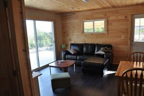 Living space with large ocean-facing sliding doors out to your private deck