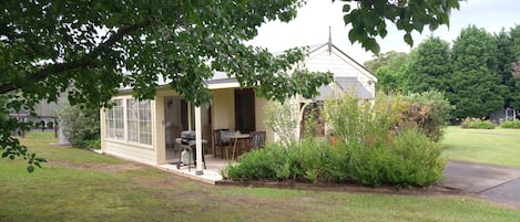 cottage is on 5 acres and overlooks paddocks trees and hills.