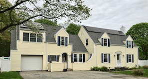 The apartment sits above the garage with a private entrance off the driveway.