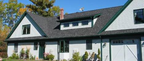 Front of the house with plenty of flowers to enjoy.