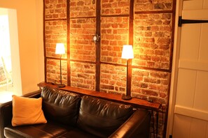 Snug with exposed brick and timber wall