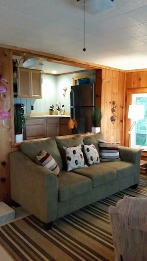 Living Room showing Kitchen in background.  View from Lakefront door.